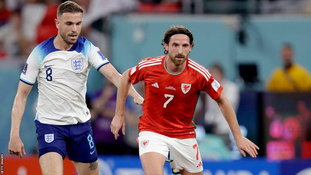 Joe Allen (right) takes on Jordan Henderson