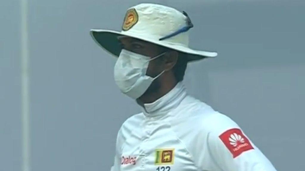 Sri Lanka captain Dinesh Chandimal wearing a mask while fielding against India in Delhi