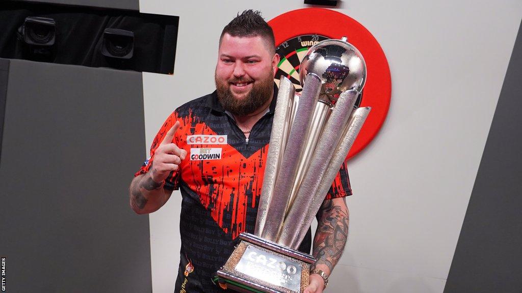 Michael Smith with the World Championship trophy