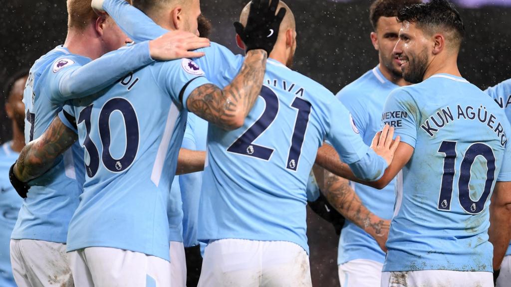 Man City players celebrate a goal