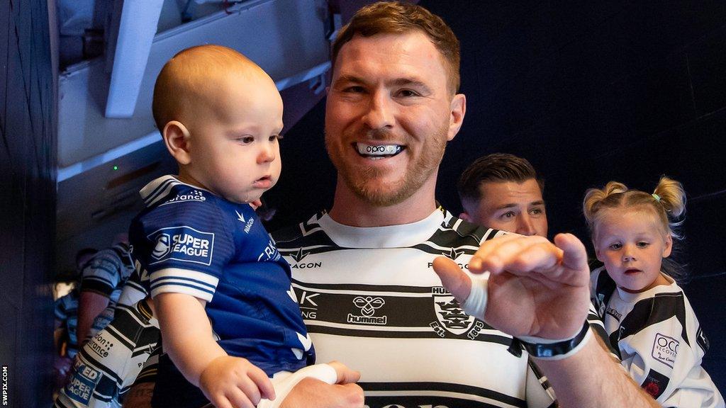 Scott Taylor cuddles his son before Hull's game with Leeds