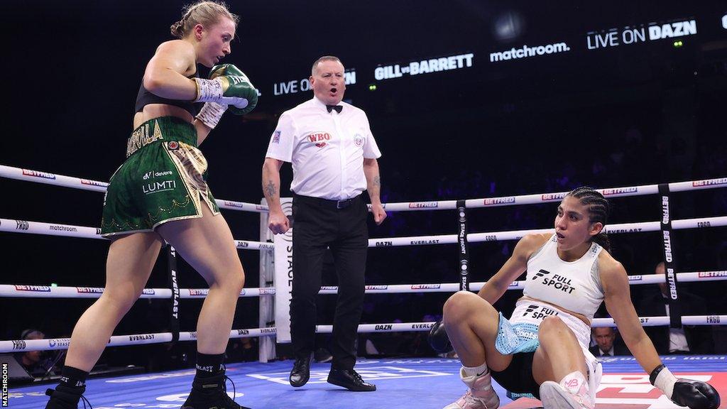 Rhiannon Dixon knocks down Karen Elizabeth Carabajal