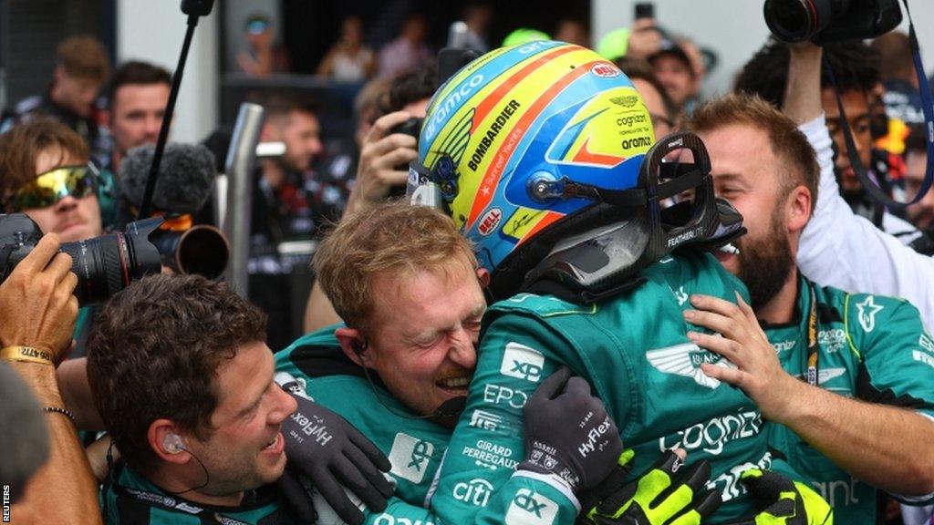 Fernando Alonso celebrates with his Aston Martin team