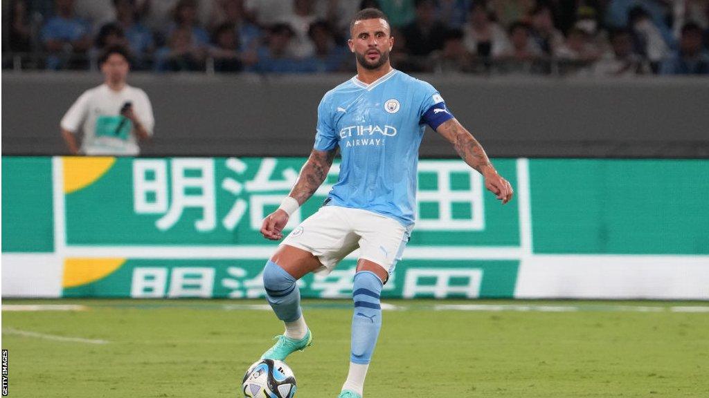 Kyle Walker kicking a football