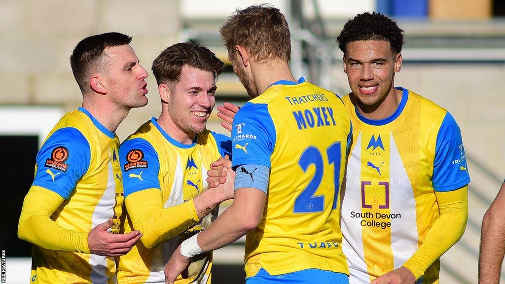 Torquay celebrate scoring a goal