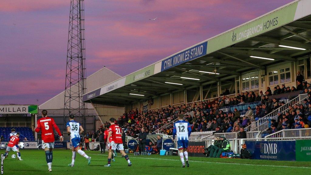 Hartlepool United fans in the Cyril Knowles Stand at Victoria Park