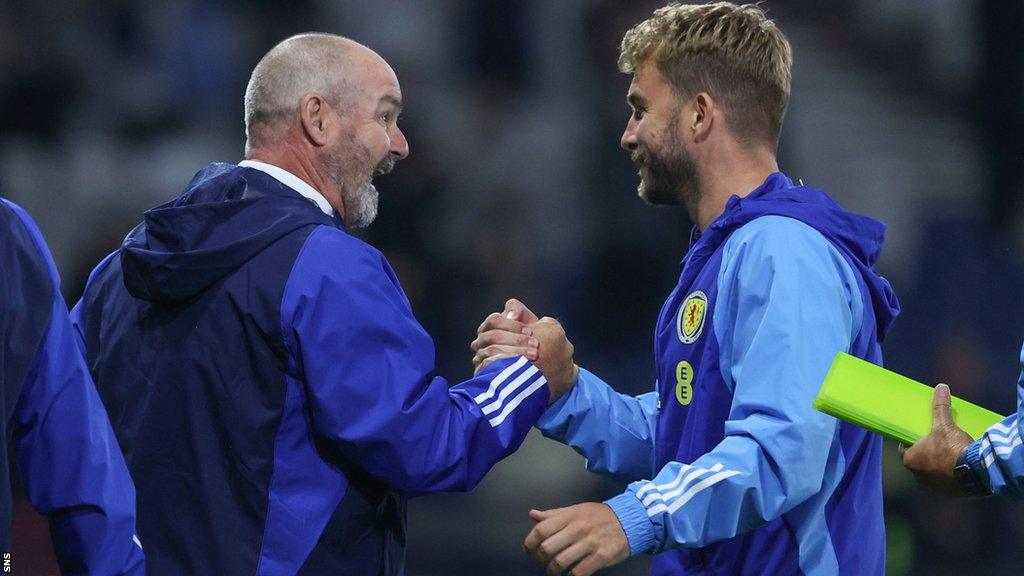 Scotland's Steve Clarke and James Morrison celebrate