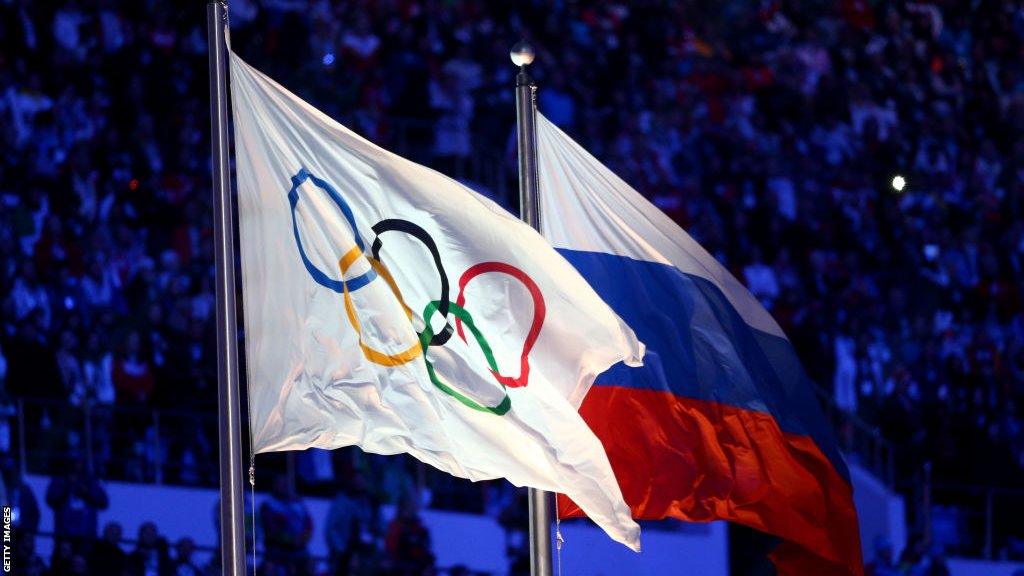 The Olympic and Russian flags pictured next to each other