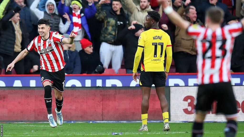 Sheffield United's John Egan celebrates after Watford’s Ryan Porteous scores an own goal