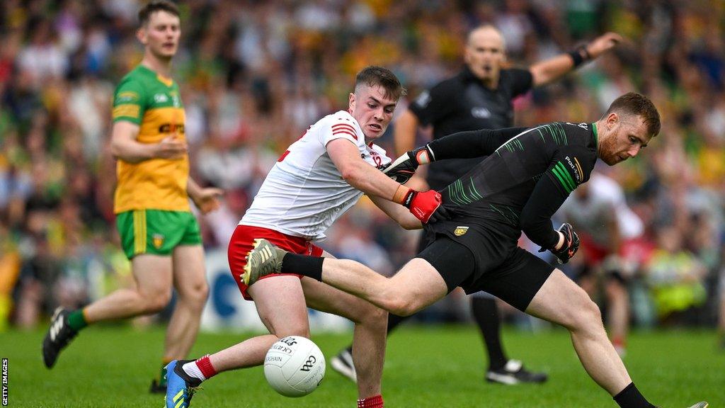 Ruairi Canavan fouls Donegal goalkeeper Shaun Patton during Saturday evening's contest in Ballybofey