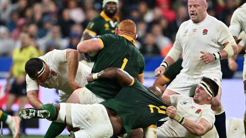 Tom Curry and Bongi Mbonambi clash during England's defeat by South Africa at the 2023 Rugby World Cup