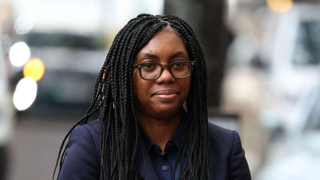 Kemi Badenoch wears a dark navy suit as she arrives at the Post Office inquiry