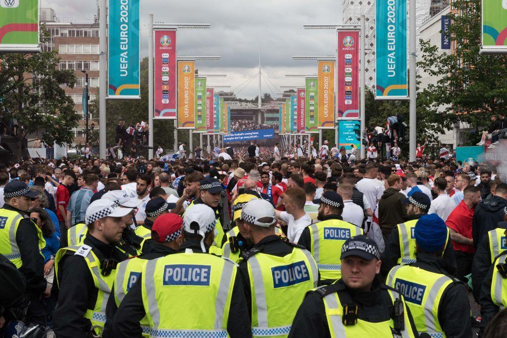 Police officers patrol the area outside Wembley Stadium as football fans arrived ahead of England match against Italy in the final of Euro 2020 Championship on July 11, 2021.