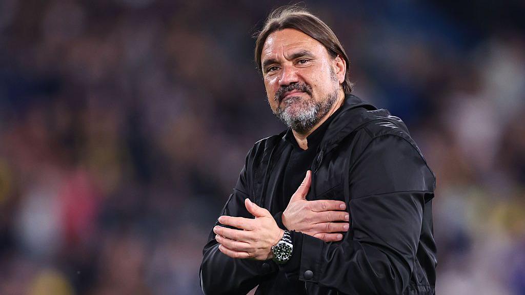 Daniel Farke taps his heart to gesture to Leeds' away fans