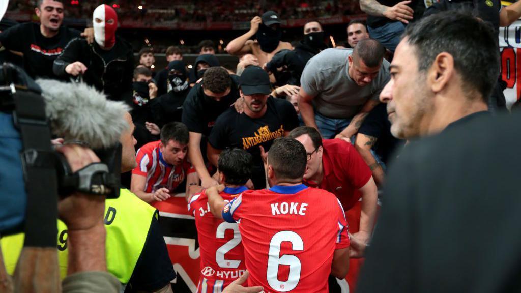 Atletico Madrid players with fans