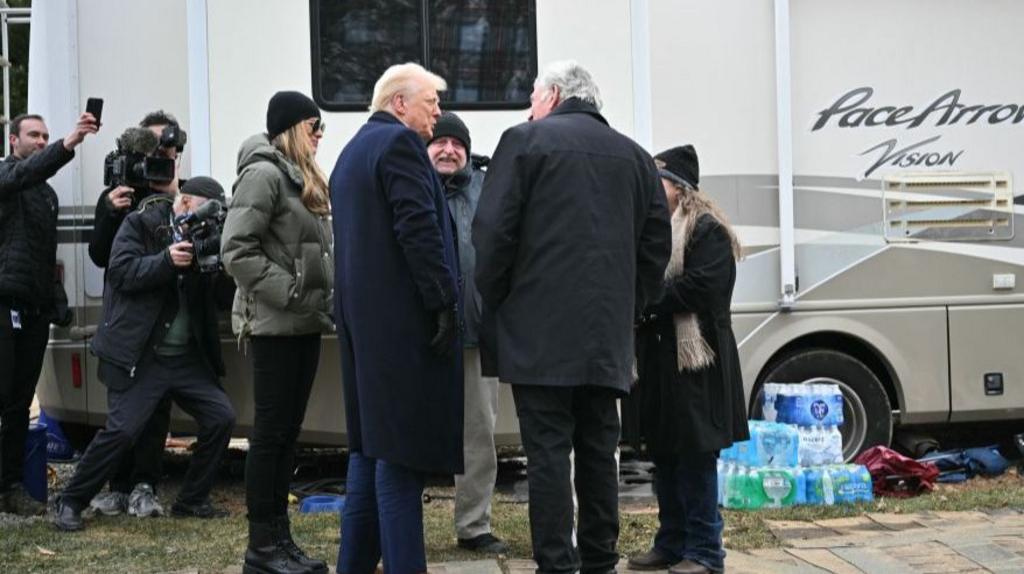 Trump, with First Lady Melania Trump, visits a neighborhood affected by Hurricane Helene 