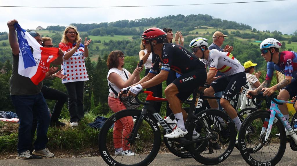 Matteo Trentin and Ivan Romeo cheered on by fans during stage 20 of the 2025 Tour de France