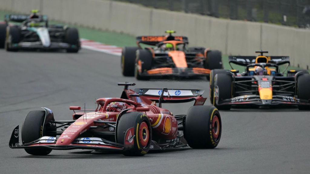 Ferrari's Charles Leclerc leads Red Bull's Max Verstappen, McLaren's Lando Norris and Mercedes' Lewis Hamilton at the Mexico City Grand Prix