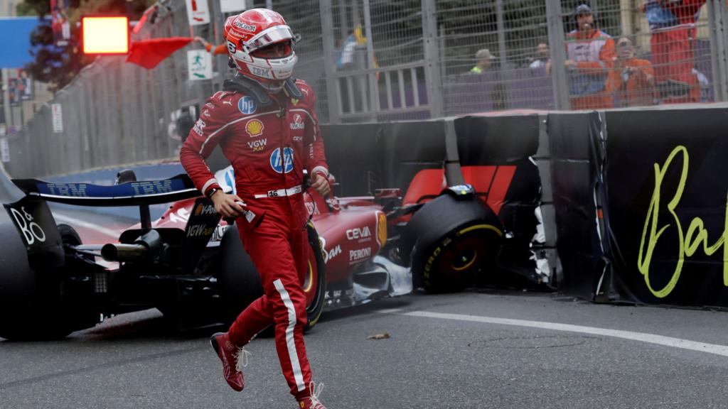 Ferrari's Charles Leclerc runs away from his crashed Ferrari