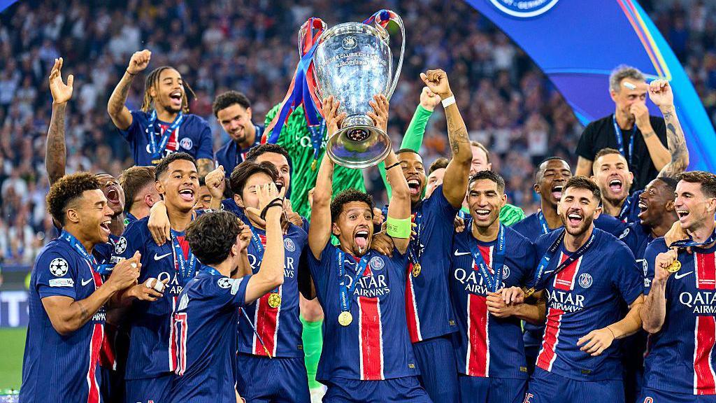 Paris St-Germain lifting the 2025 Champions League trophy 