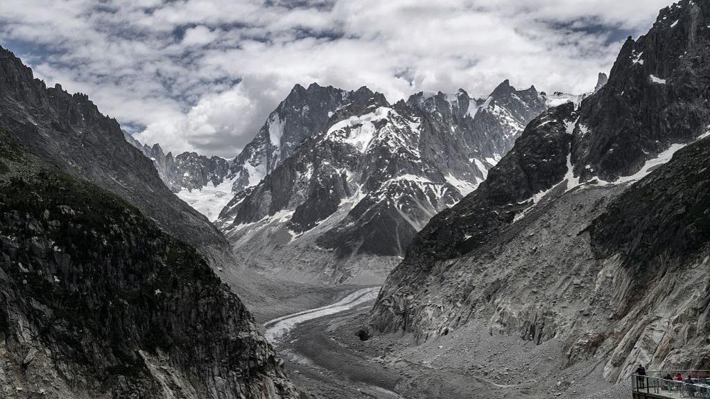 This photograph shows the Mont-Blanc massif mountains and the "Mer de Glace" glacier seen from the Montenvers train from Chamonix to the Montenvers - Mer de Glace point of view, at the Montenvers station in the French Alps, central-eastern France on June 17, 2026.