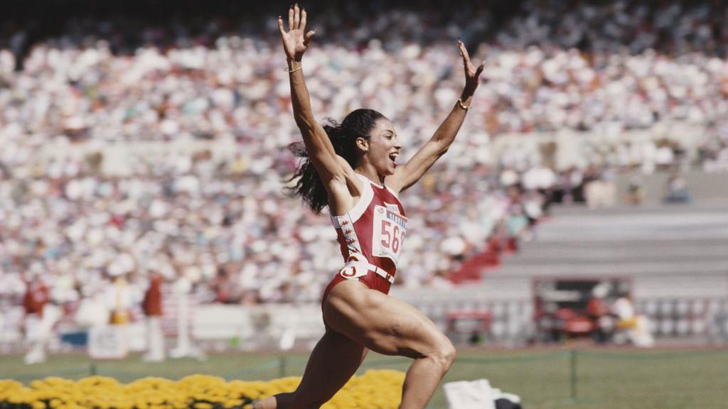 Florence Griffith Joyner celebrates winning gold in the women's 100m at the 1988 Olympics