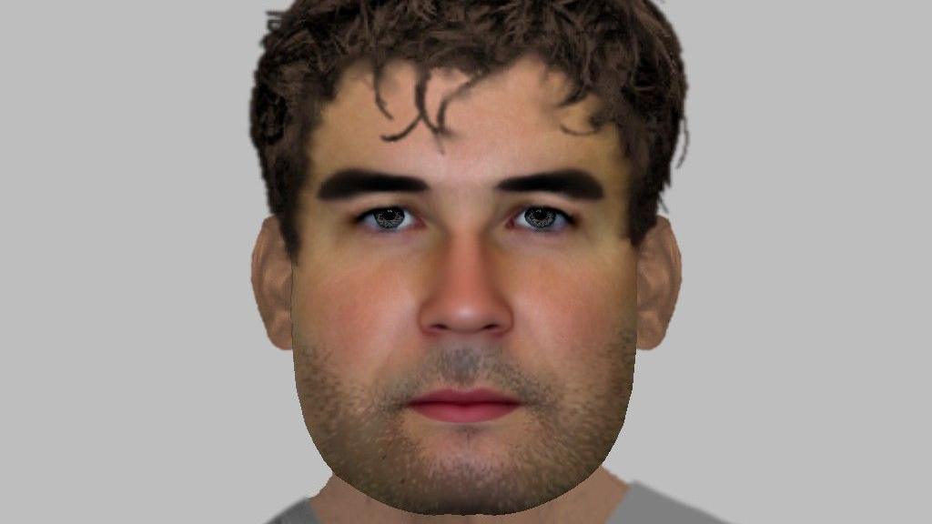 An E-fit of a youngish man with dark hair and stubble