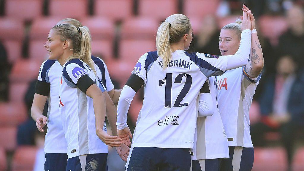 Tottenham players celebrate after Bethany England's goal