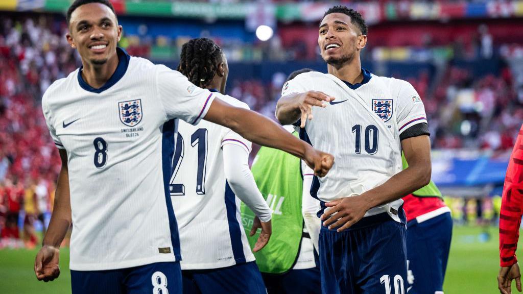 Trent Alexander-Arnold and Jude Bellingham celebrate after England's win against Switzerland at Euro 2024