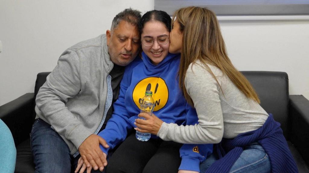 Released Israeli hostage Liri Albag is embraced by her family