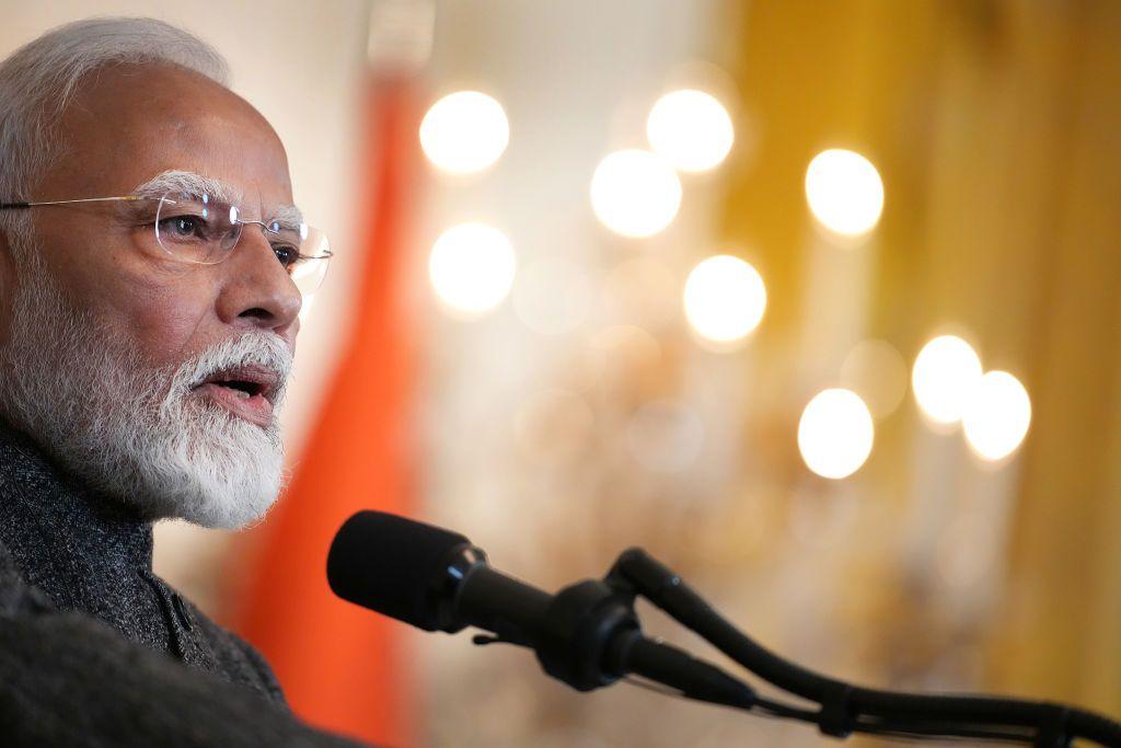 narendra modi speaking into a microphone