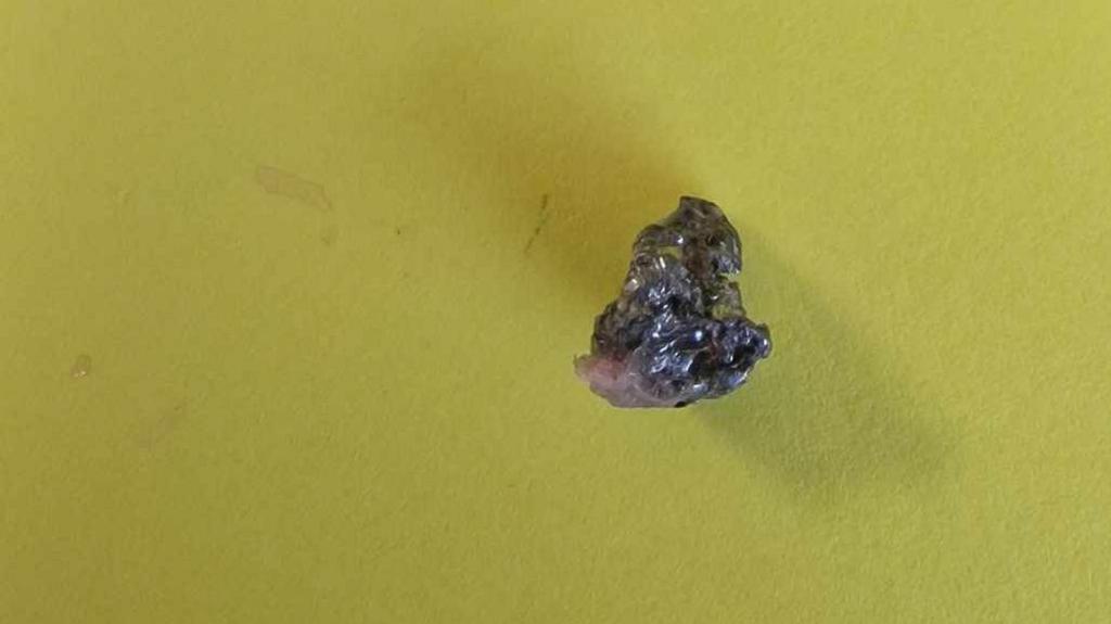 The air gun pellet on a yellow sheet