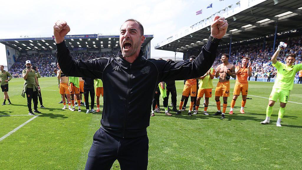 Ruben Selles celebrates his side staying up after a point at Fratton Park