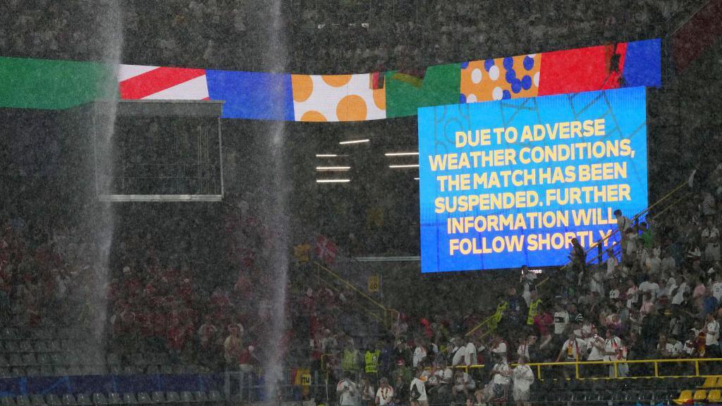 Heavy rain falls during the Euro 2024 match between Germany and Denmark in Dortmund