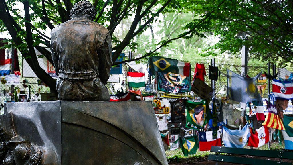 Flags and banners are left at the Ayrton Senna Memorial in Imola