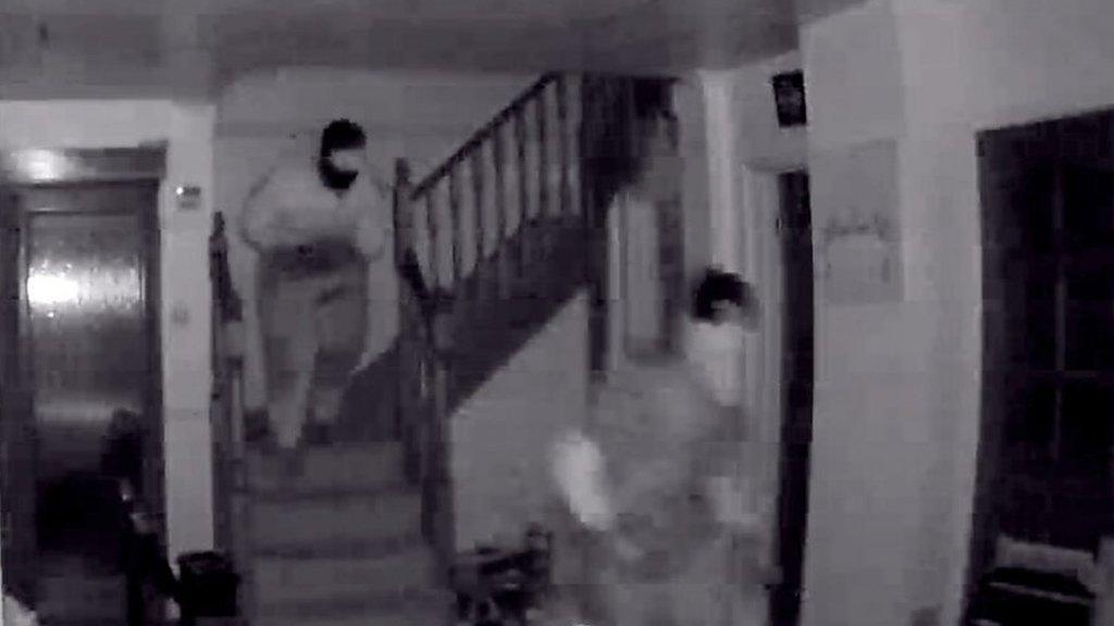 CCTV footage of two people in a house