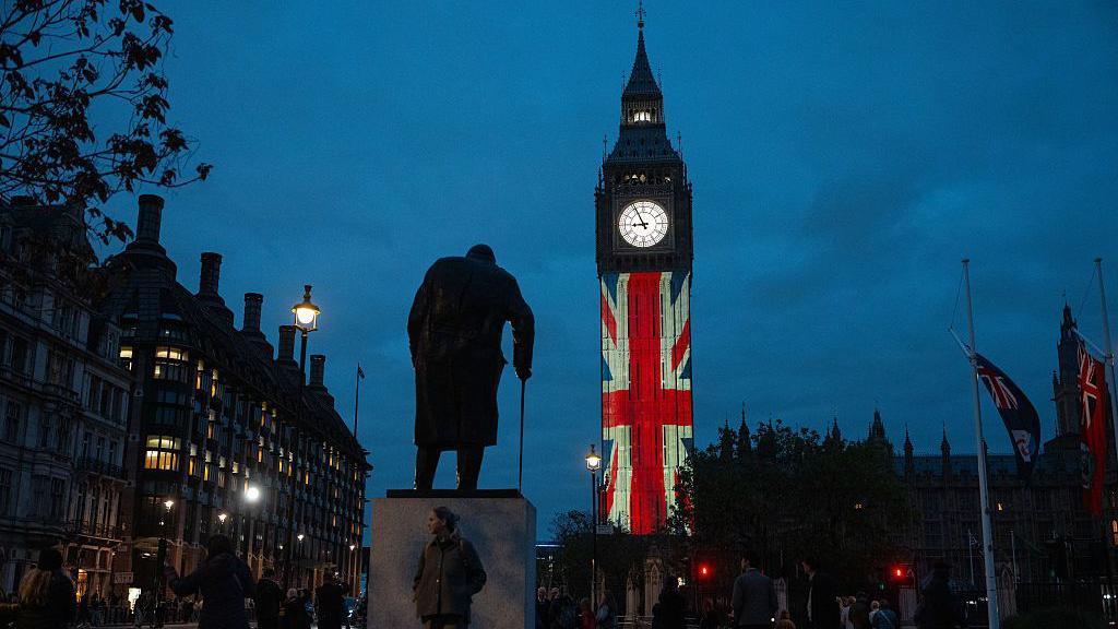 Big Ben lit up with UK flag