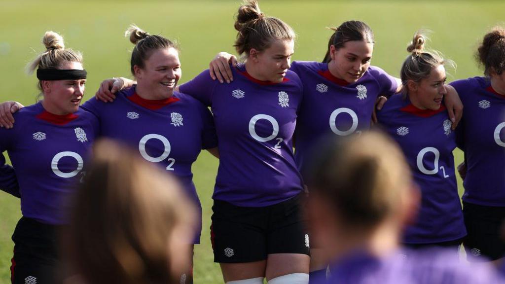 England players in a huddle during training before Italy game