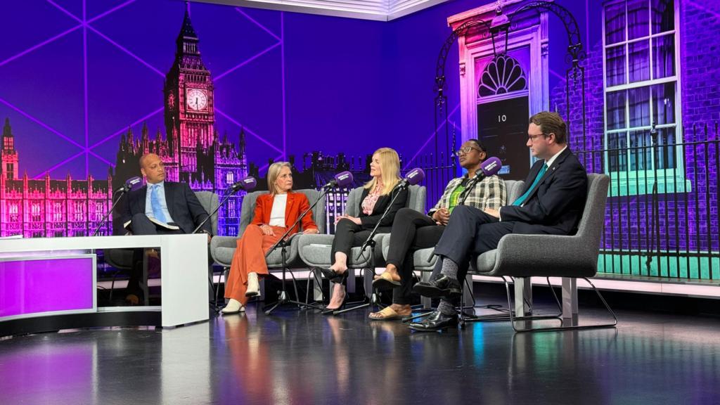 Candidates in the studio, sat on grey chairs with a purple background