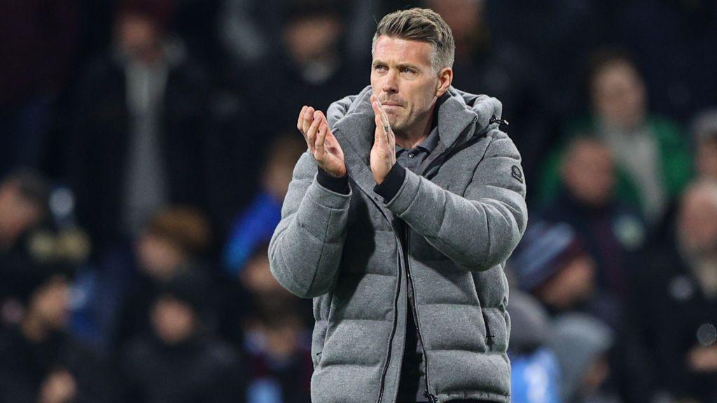  Luton Town manager Rob Edwards applauds the fans after the draw with Burnley