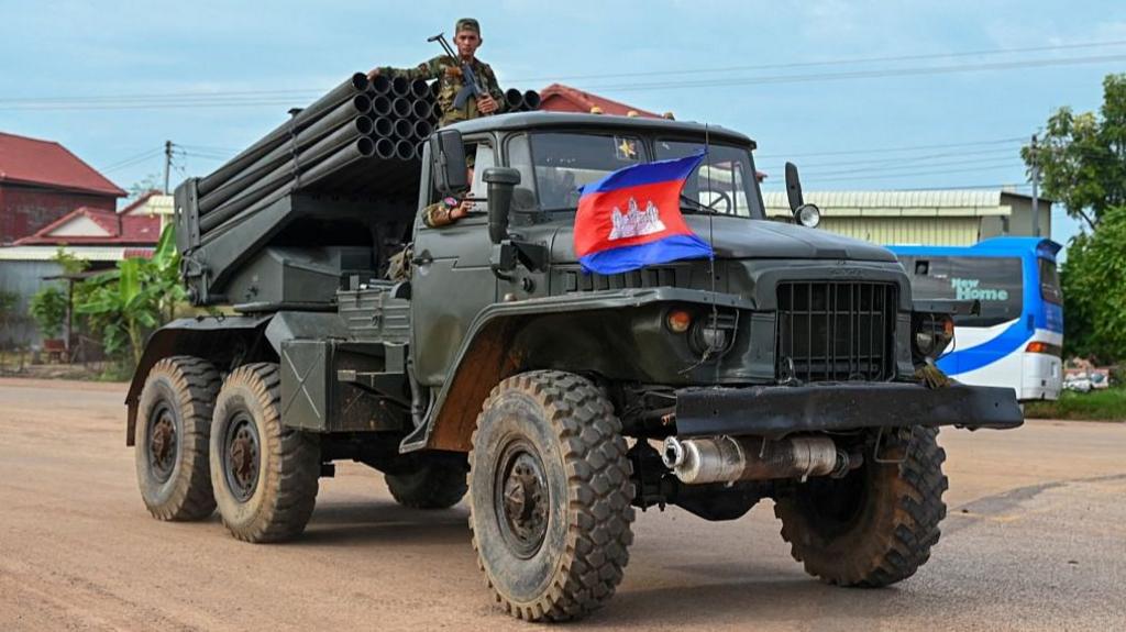 Cambodian soldier riding a military truck