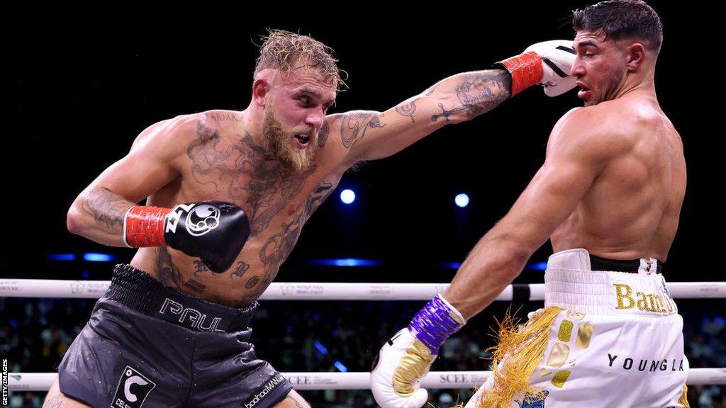 Jake Paul attempts to punch Tommy Fury