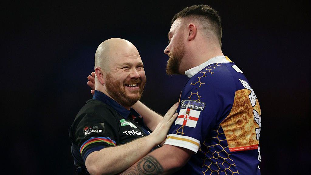 Justin Hood embraces Josh Rock