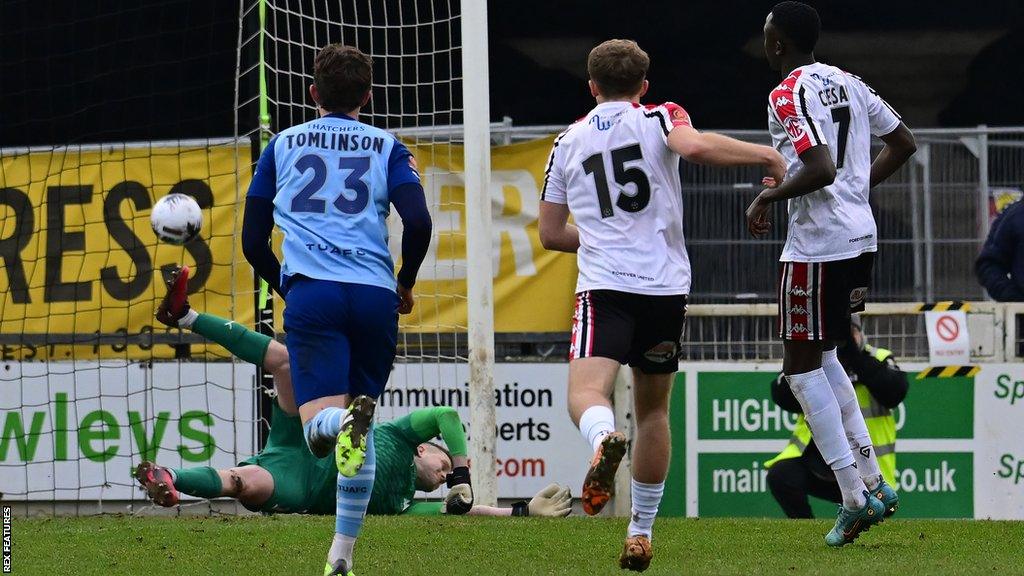 Yusifu Ceesay scores his 37th-minute penalty