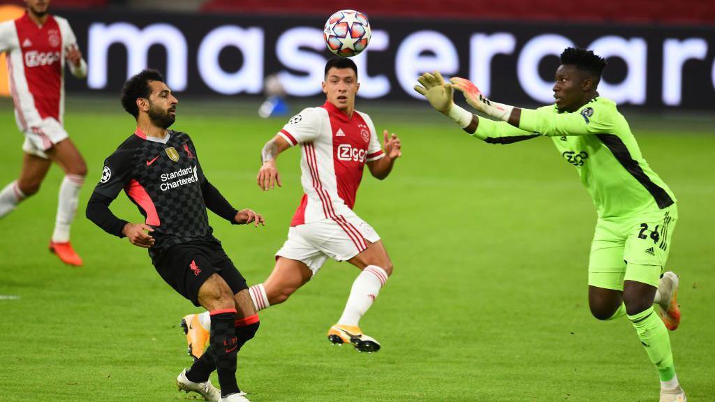 Mo Salah and André Onana in action.