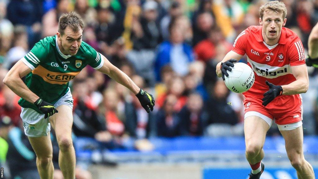 Derry's Brendan Rogers attempts to burst away from Kerry's Jack Barry