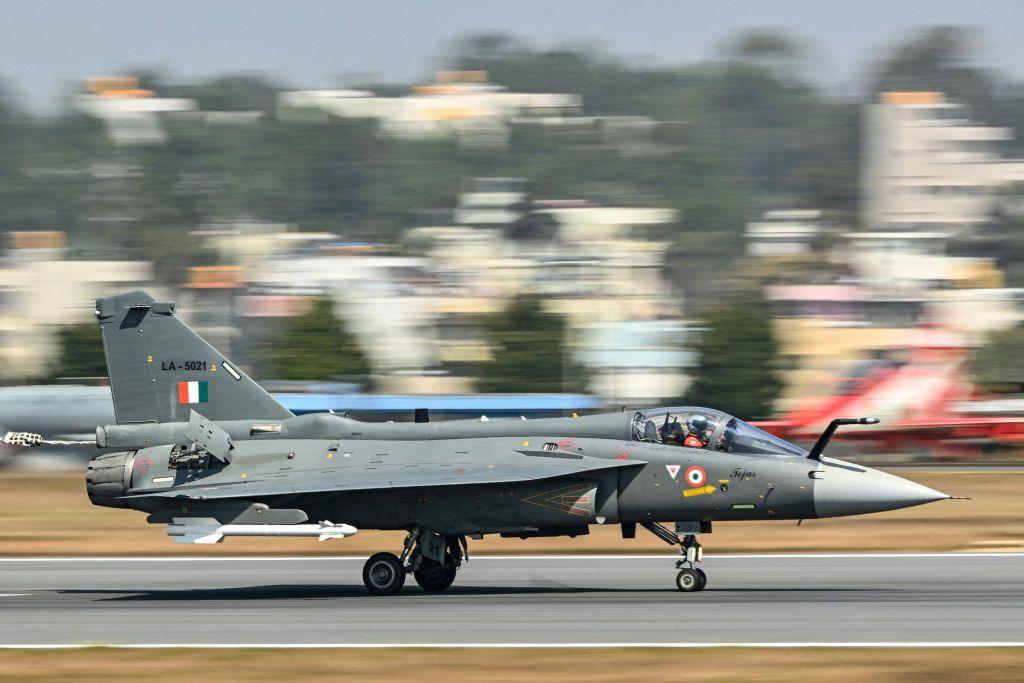 The Indian Air Force (IAF) HAL Tejas fighter jet prepares to take off during Aero India 2025, a military aviation exhibition at the Yelahanka Air Force Station in Bengaluru on February 13, 2025.