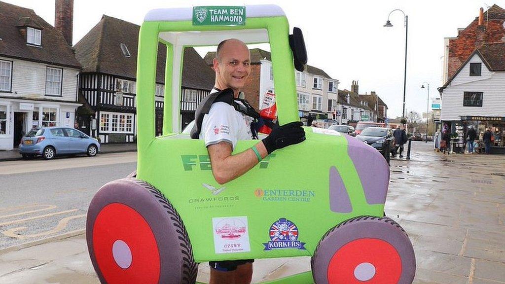 Phil Sweatman running 2.6 miles backwards dressed as a tractor