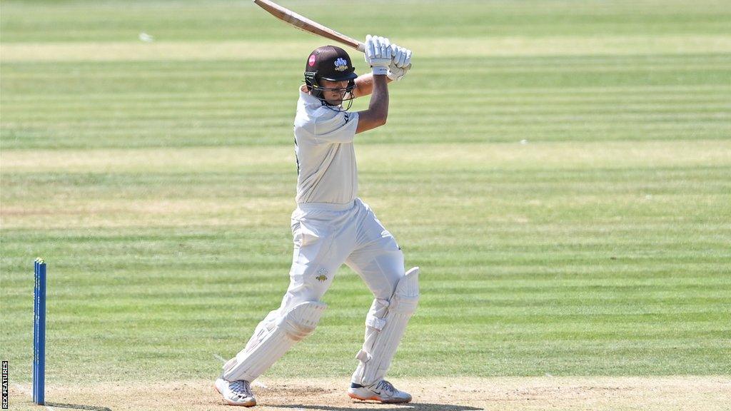 Aaron Hardie plays a shot with the bat for Surrey