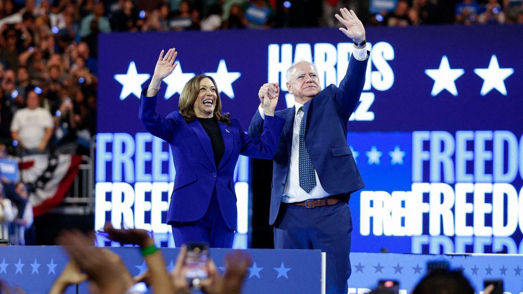 Kamala Harris and Tim Walz at a campaign event